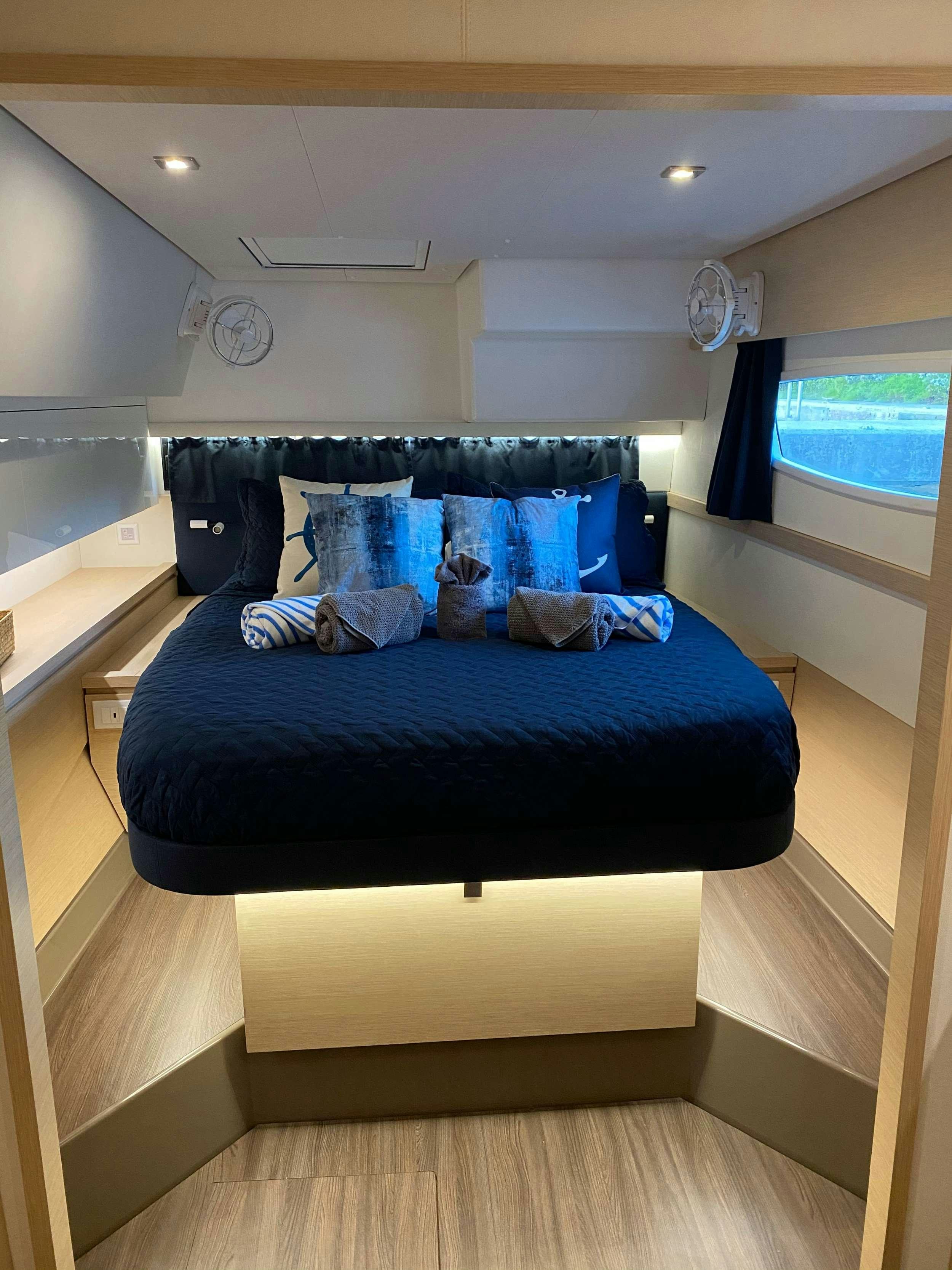 a bed in a room aboard Sol Mates Yacht for Charter
