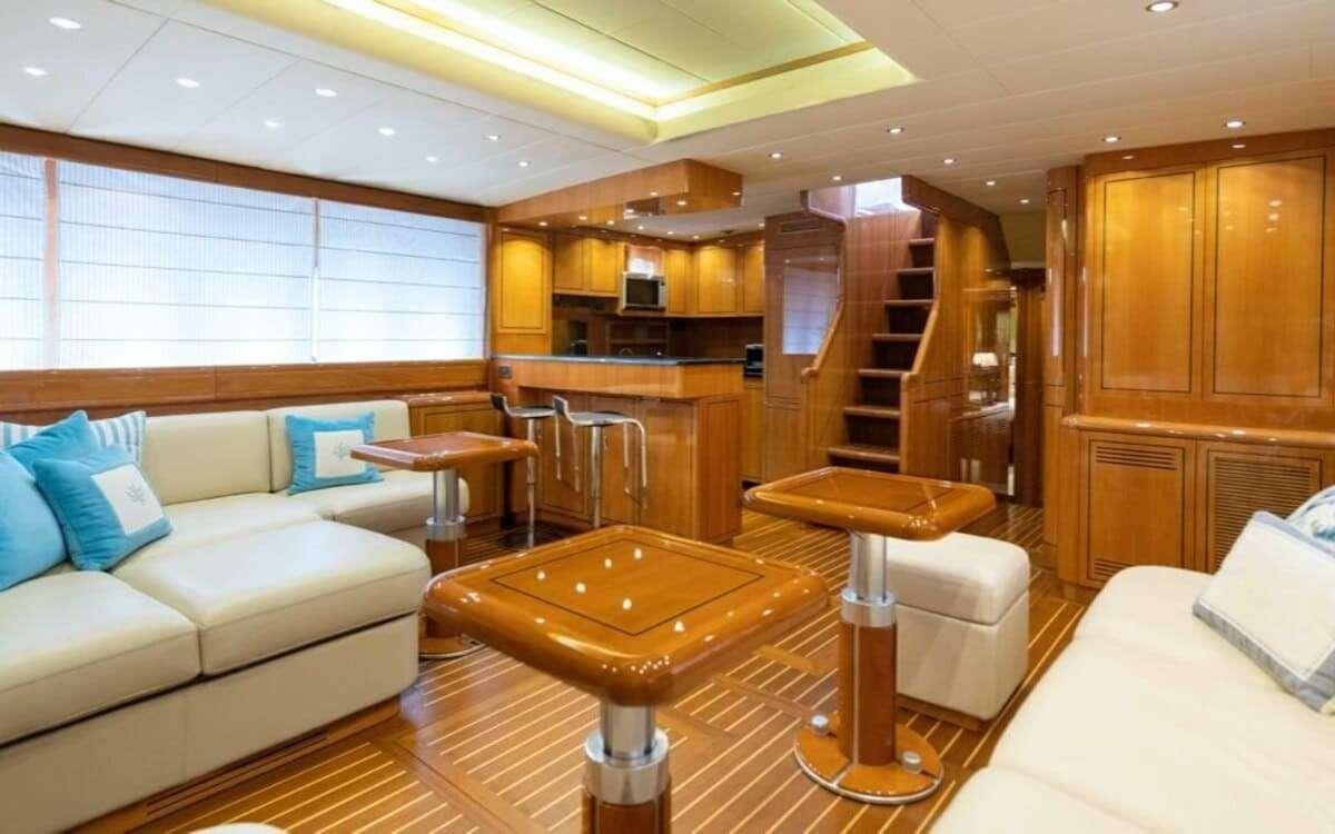 a living room with a staircase aboard HAPPY Yacht for Charter