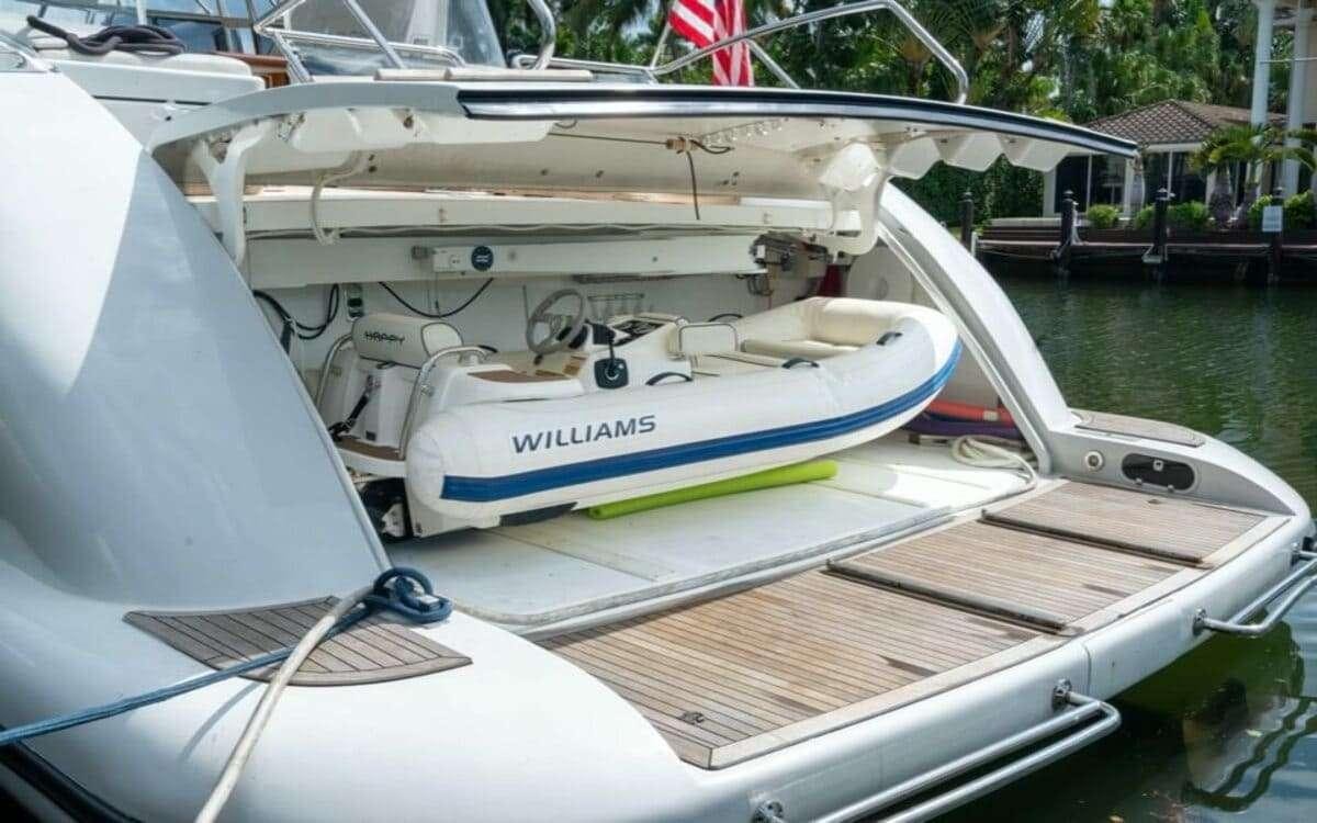 a couple of boats on a dock aboard HAPPY Yacht for Charter