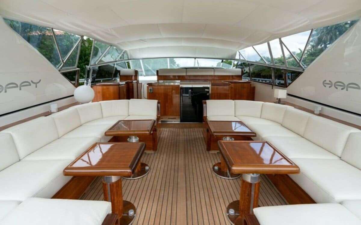 a living room with a couch and a table aboard HAPPY Yacht for Charter