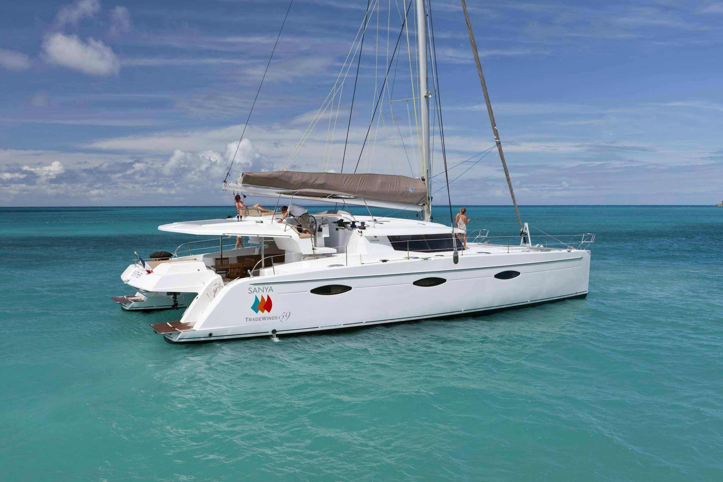 a white boat in the water aboard GRATITUDE Yacht for Charter