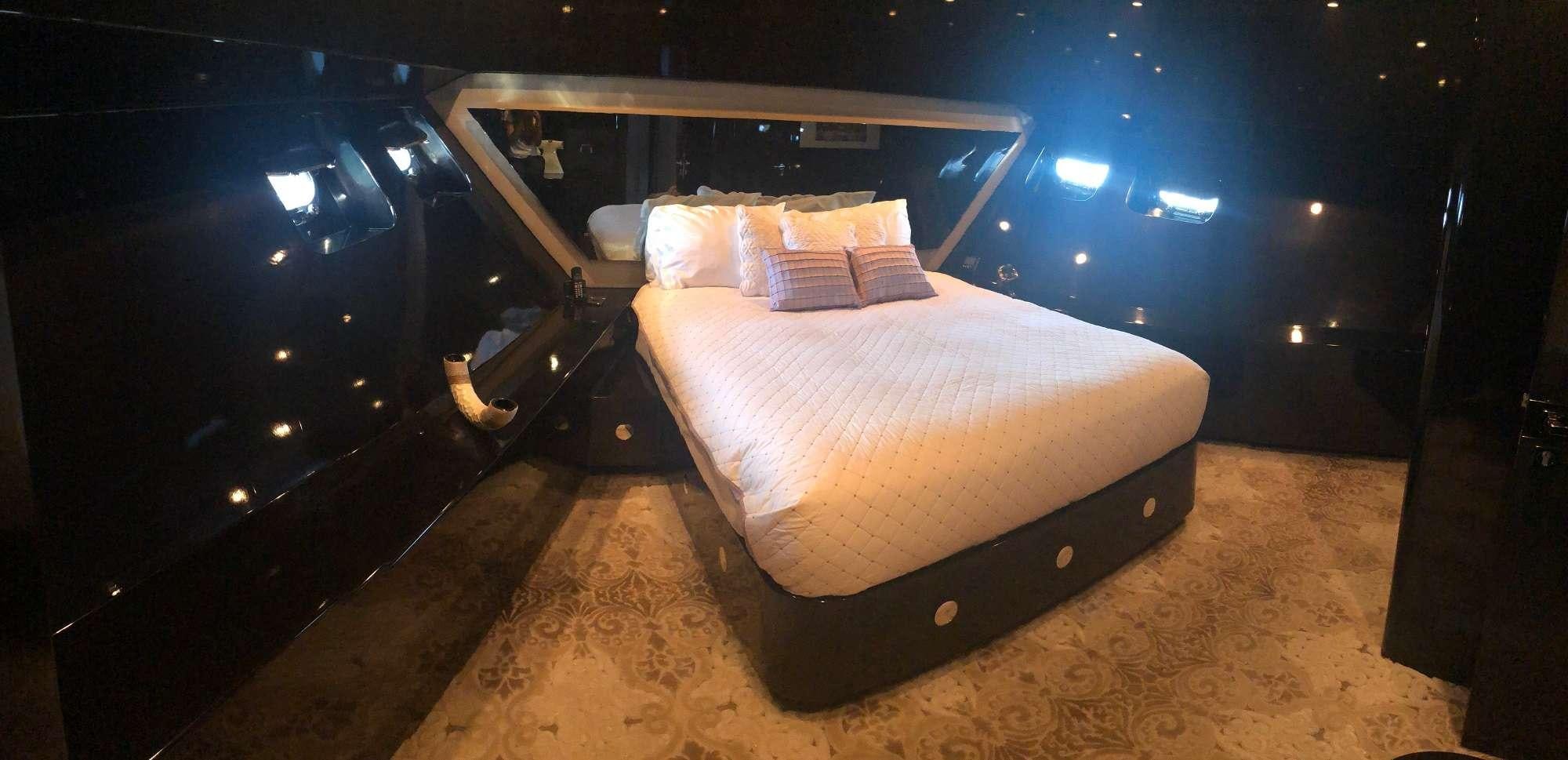 a bed in a room aboard CLAREMONT Yacht for Charter
