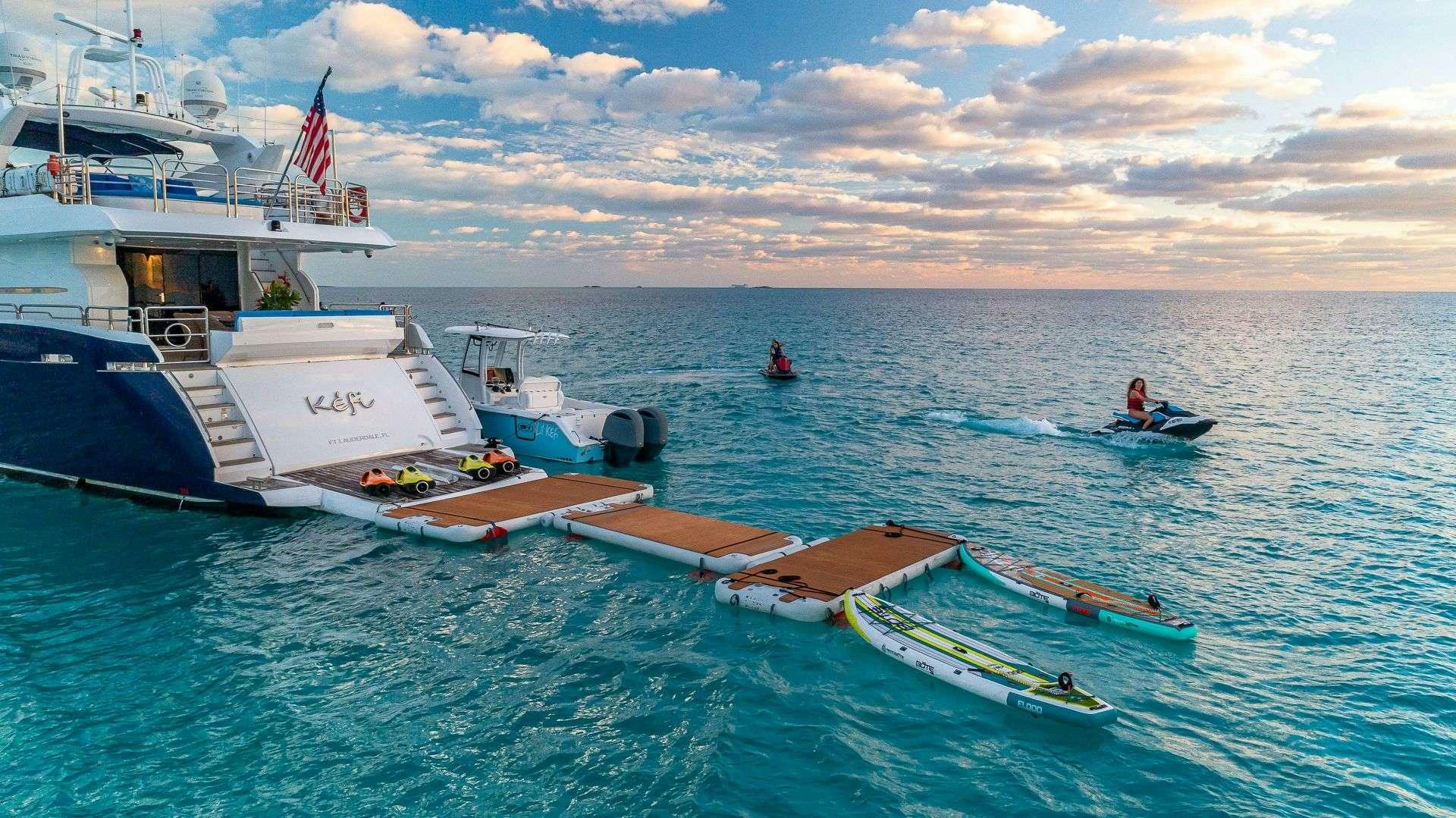a couple of boats in the water aboard KEFI Yacht for Charter