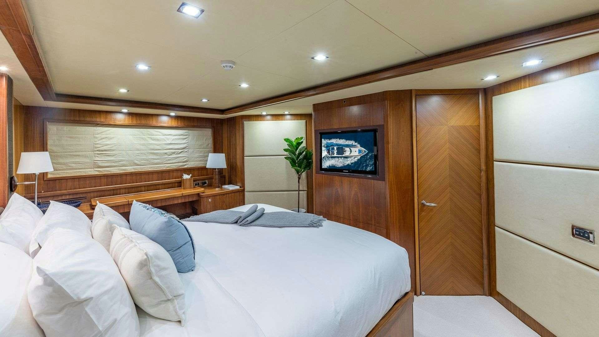 a hotel room with a bed aboard KEFI Yacht for Charter