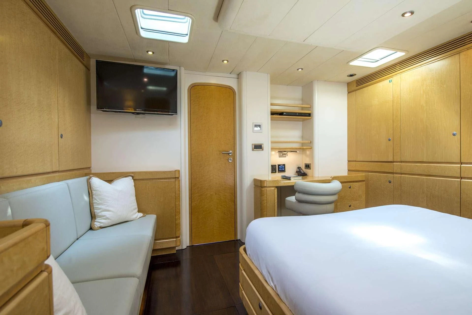 a room with a bed and a couch aboard LADY 8 Yacht for Charter