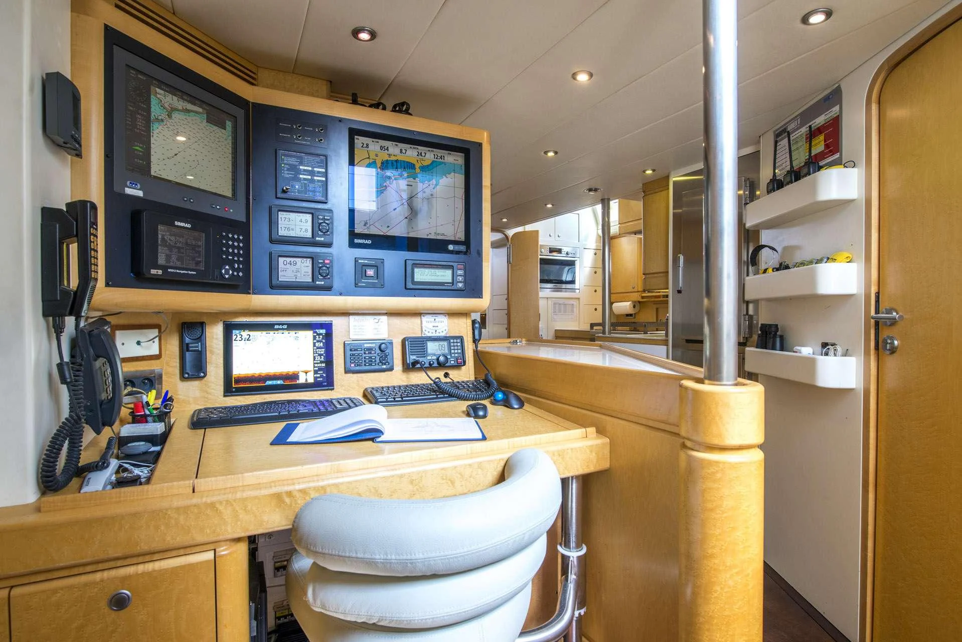 a desk with a computer and a television on it aboard LADY 8 Yacht for Charter