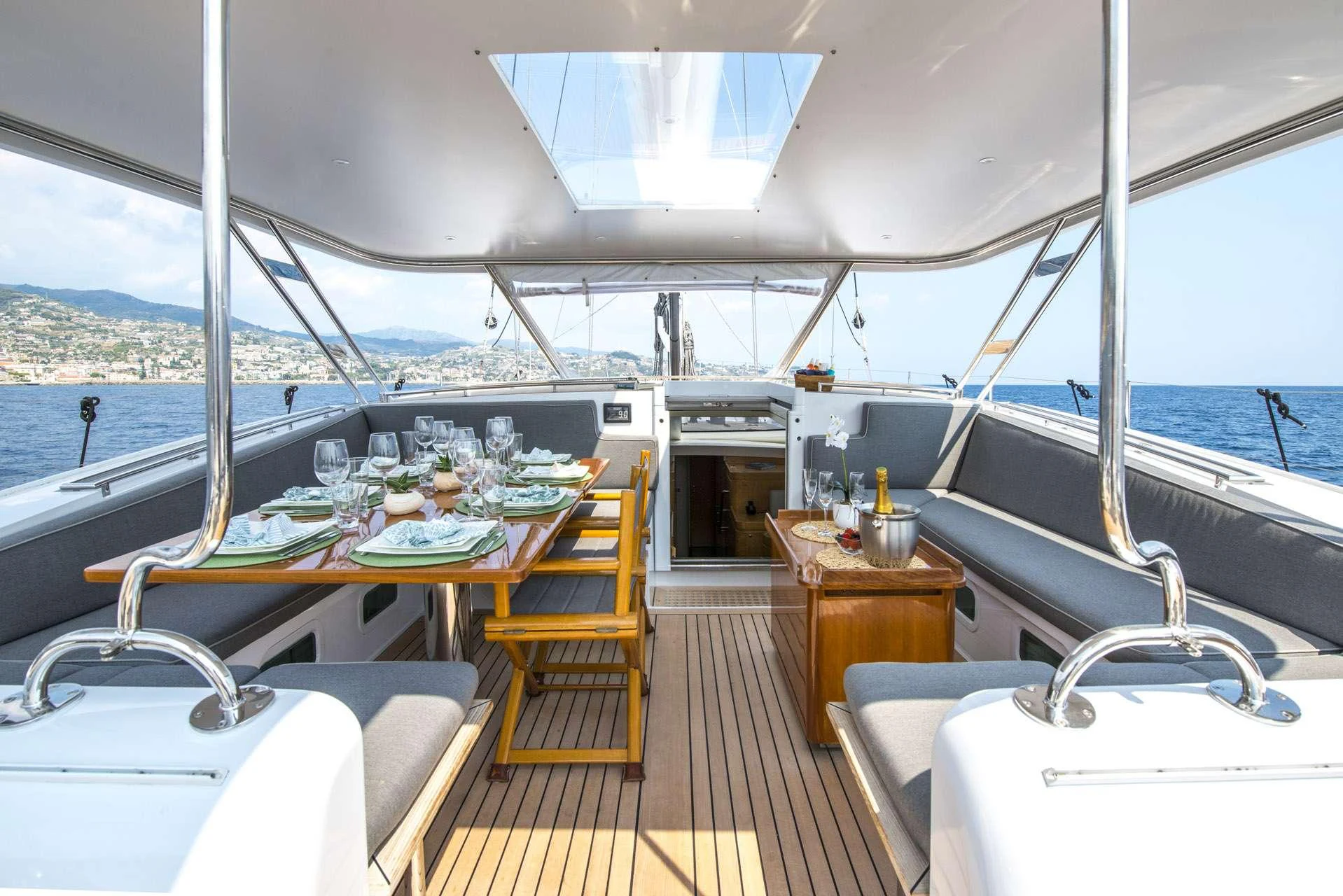 a boat with a table and chairs aboard LADY 8 Yacht for Charter