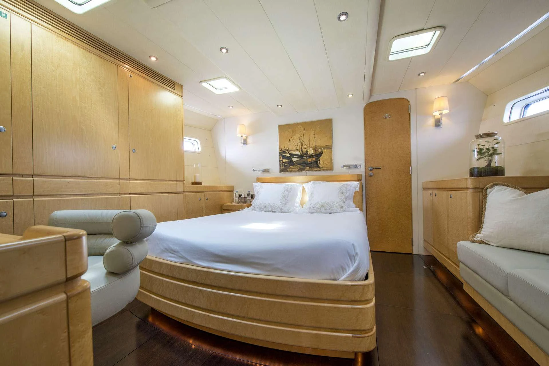 a room with a bed and a couch aboard LADY 8 Yacht for Charter
