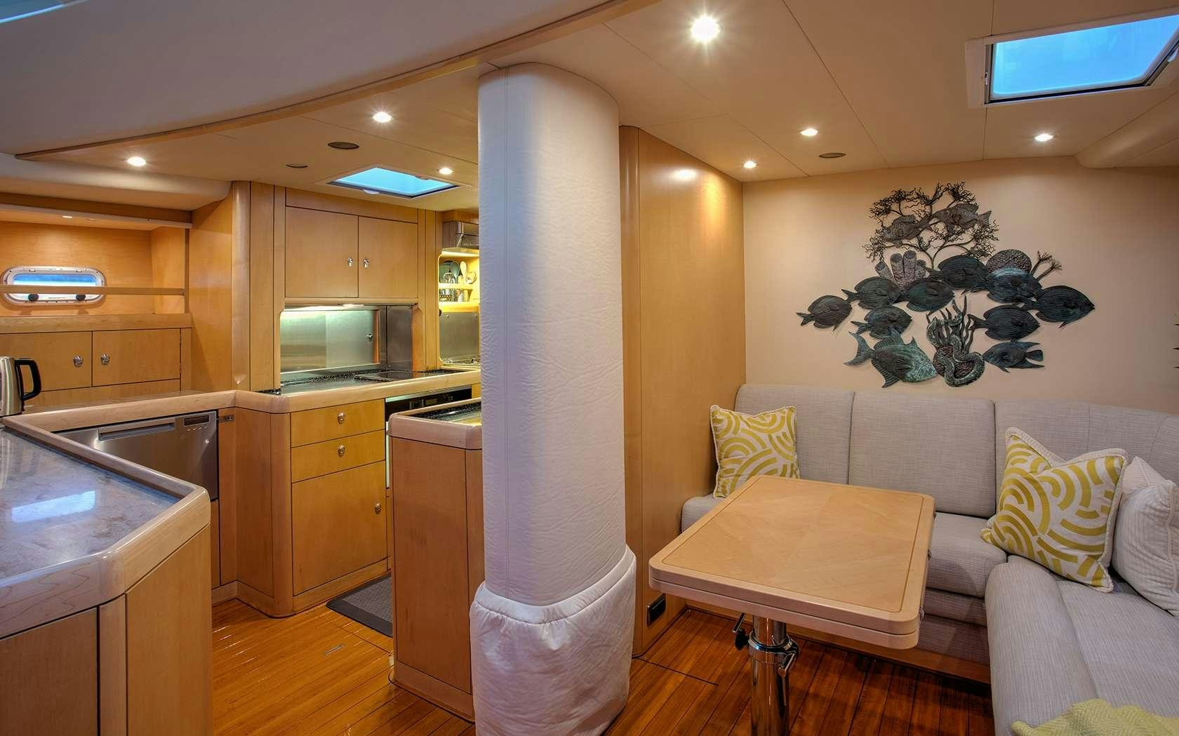 a large kitchen with a large refrigerator aboard DAMA DE NOCHE Yacht for Charter