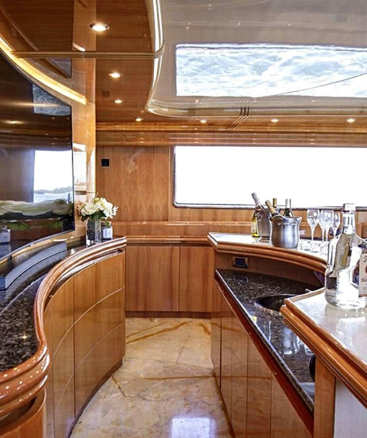 a kitchen with a sink and a window aboard 103' CUSTOM BUILD Yacht for Charter