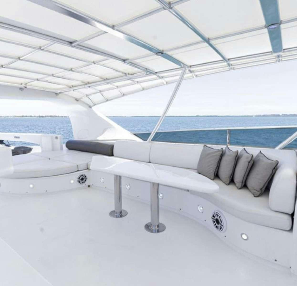 a white boat on a white surface aboard 103' CUSTOM BUILD Yacht for Charter