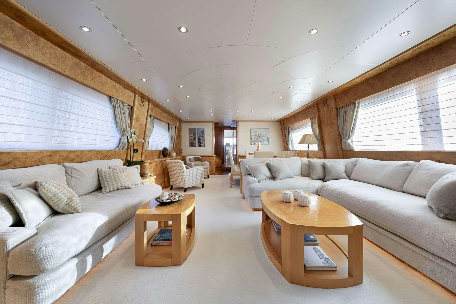 a living room with a couch and a coffee table aboard ANDILIS Yacht for Charter