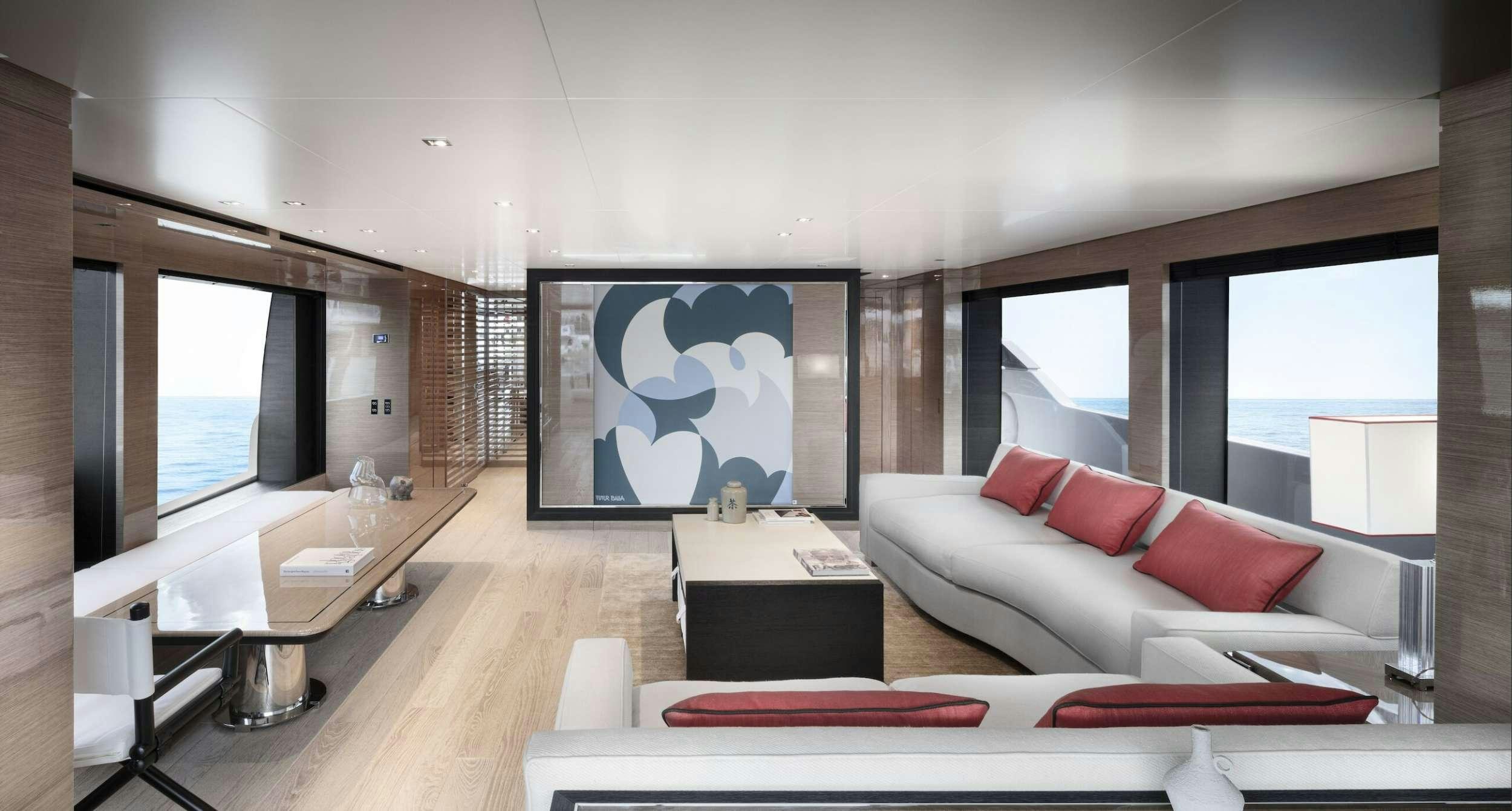 a living room with a large screen aboard REINE D'AZUR Yacht for Charter