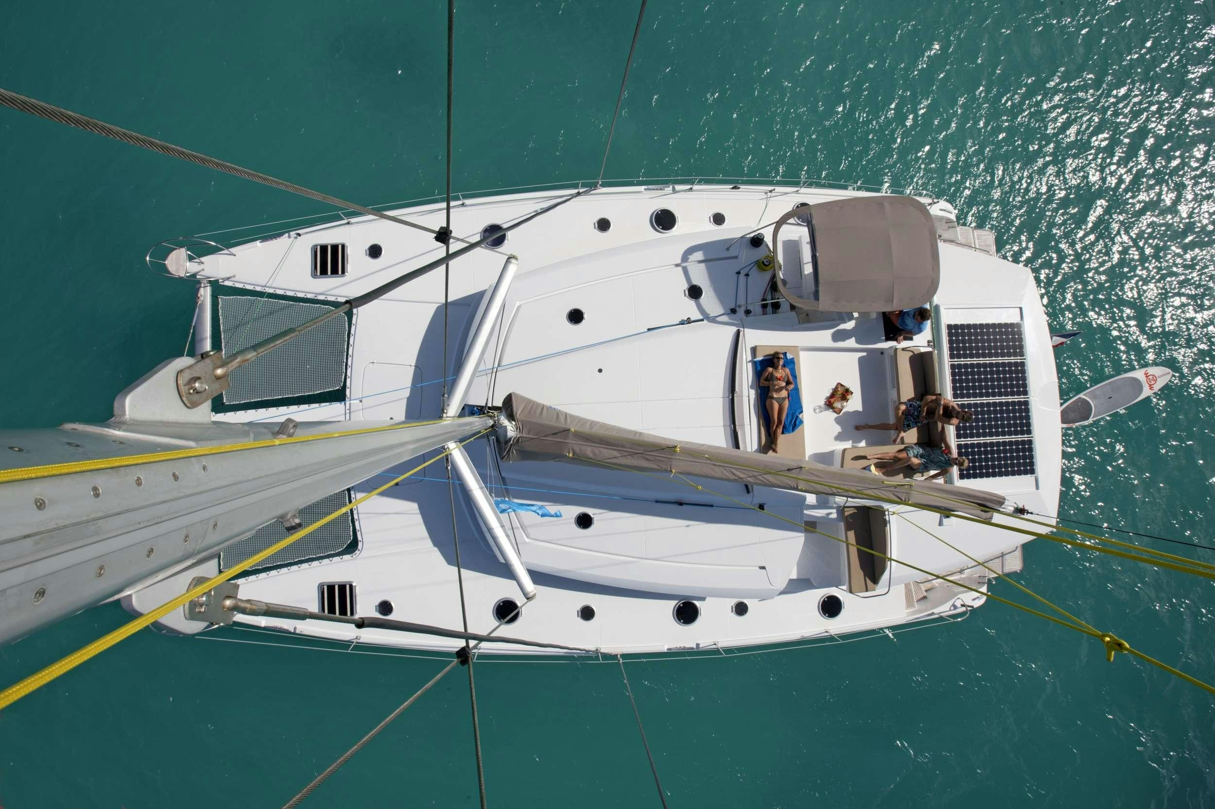 a boat with a group of people on it aboard TE MOANA - LUXURY TW59 Yacht for Charter