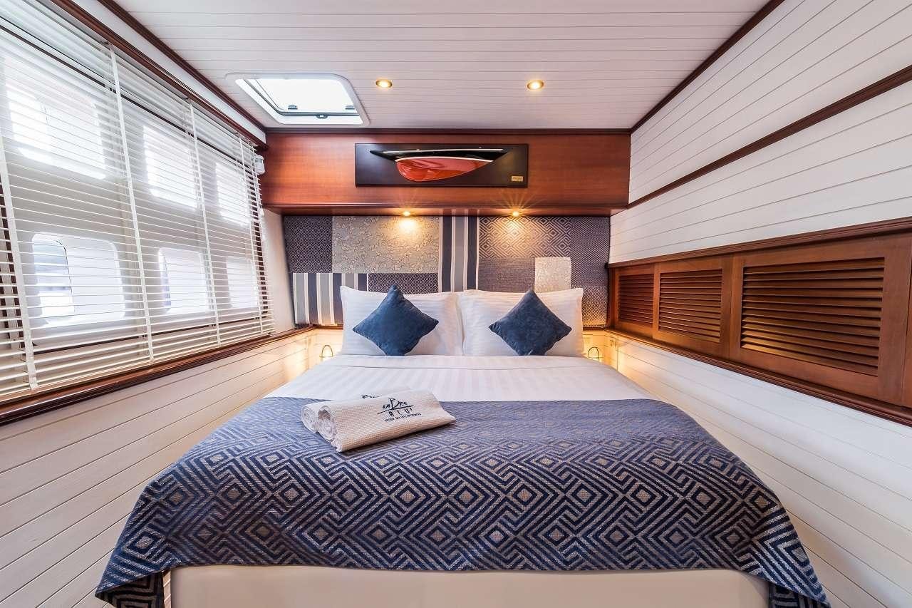 a bed in a room aboard OMBRE BLU³ Yacht for Charter