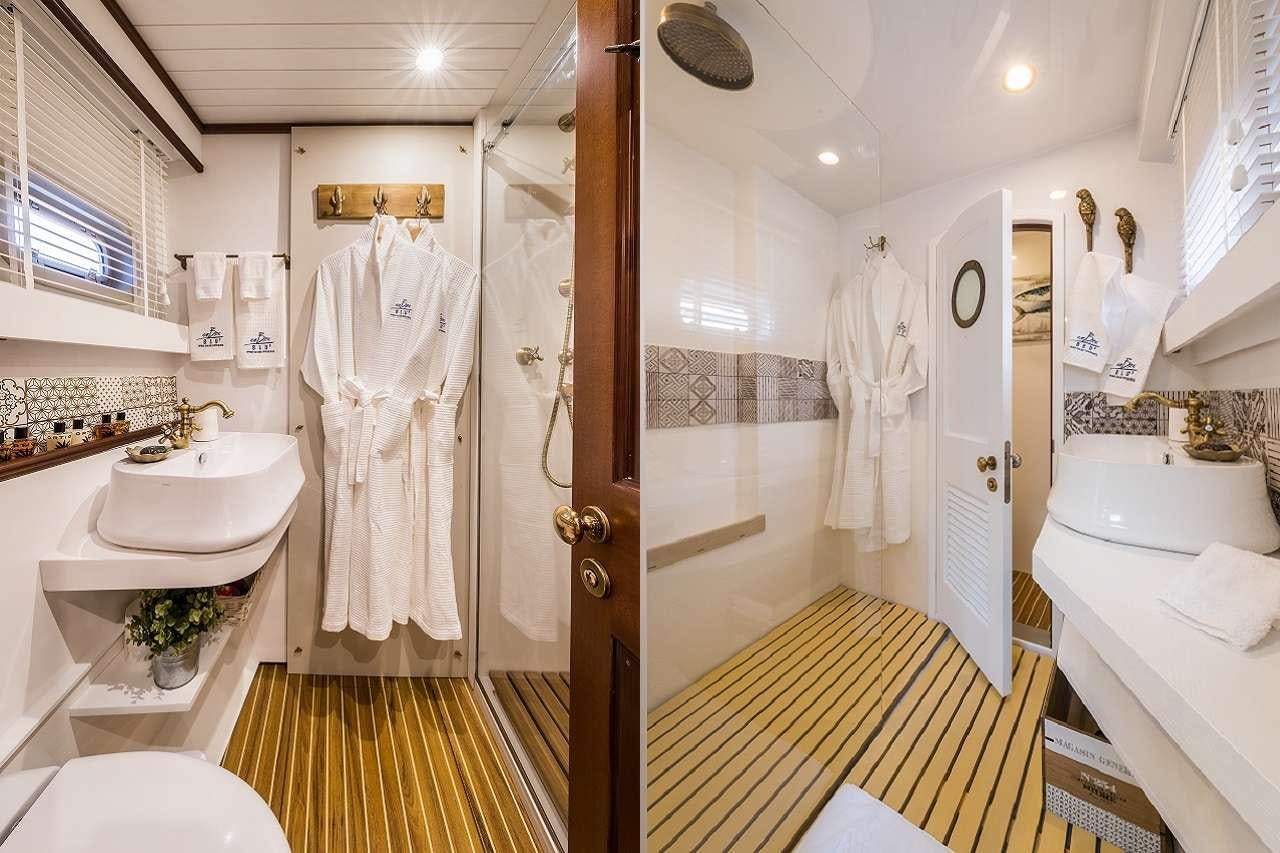 a bathroom with a standup shower aboard OMBRE BLU³ Yacht for Charter