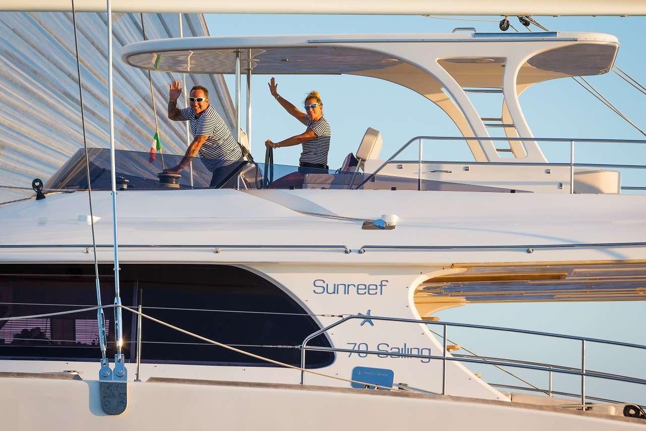 a couple of people on a boat aboard OMBRE BLU³ Yacht for Charter