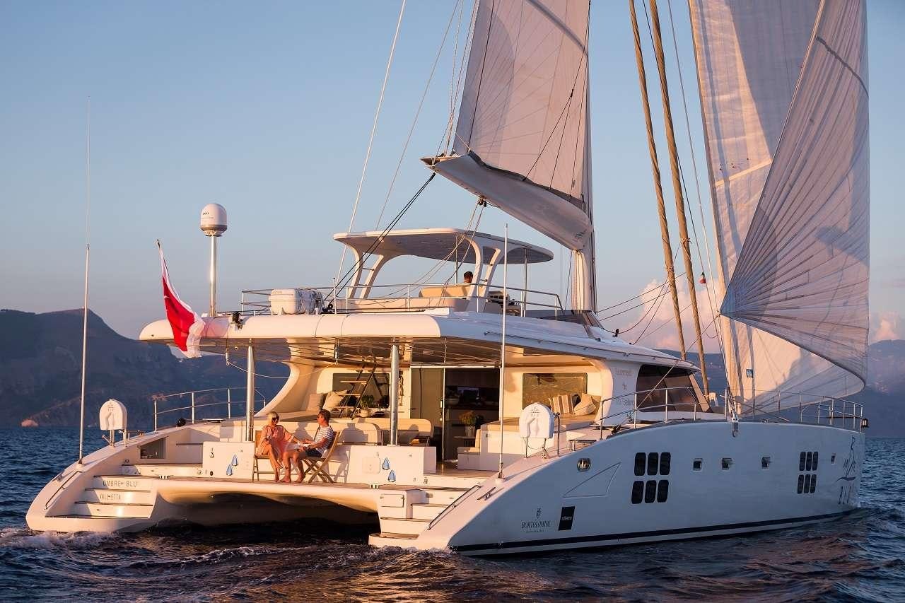 a boat with a sail aboard OMBRE BLU³ Yacht for Charter