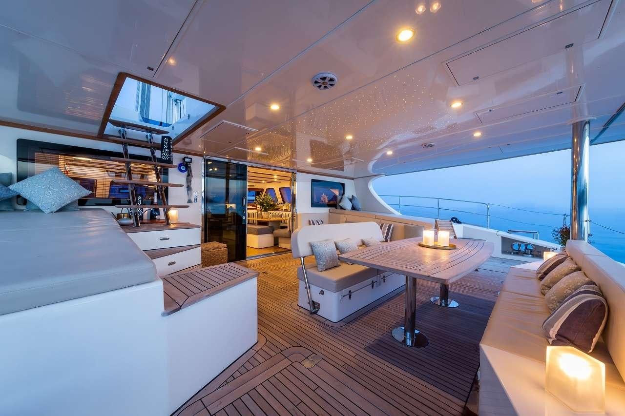 a room with a bed and a table aboard OMBRE BLU³ Yacht for Charter