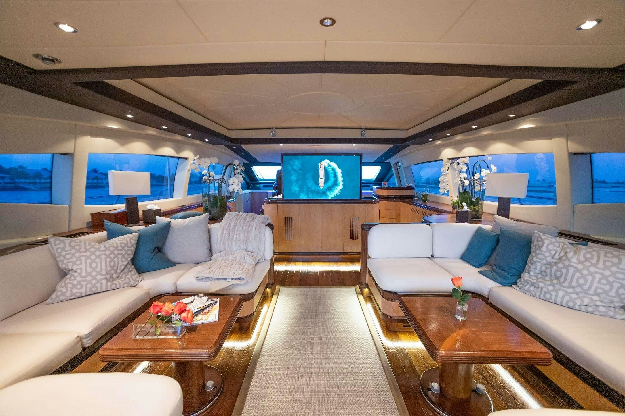 a living room with a couch and a table aboard FREE SPIRIT Yacht for Charter