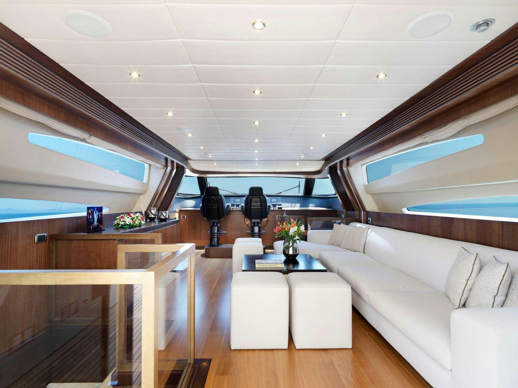 a room with a couch and a table aboard RUBY Yacht for Charter