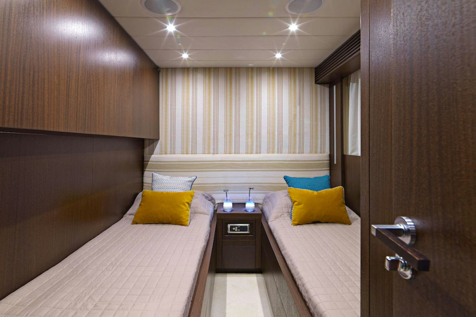 a room with two beds aboard RUBY Yacht for Charter