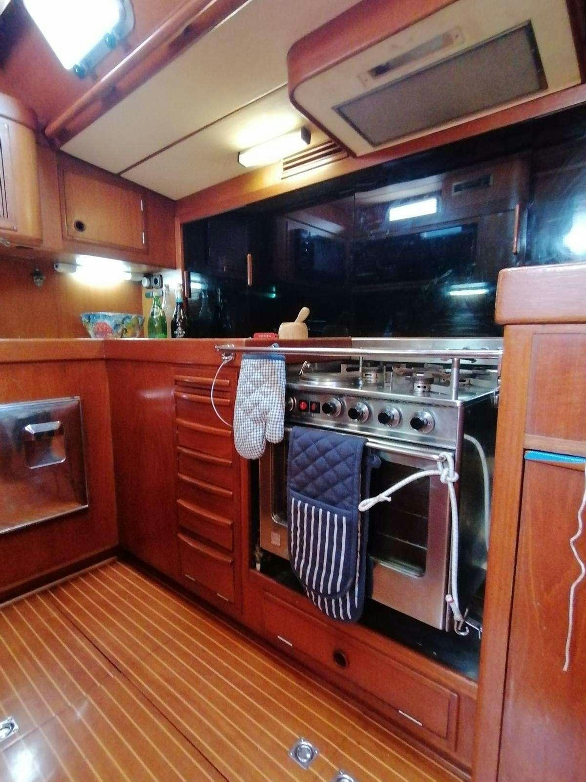 a kitchen with a stove and oven aboard AURORA Yacht for Charter