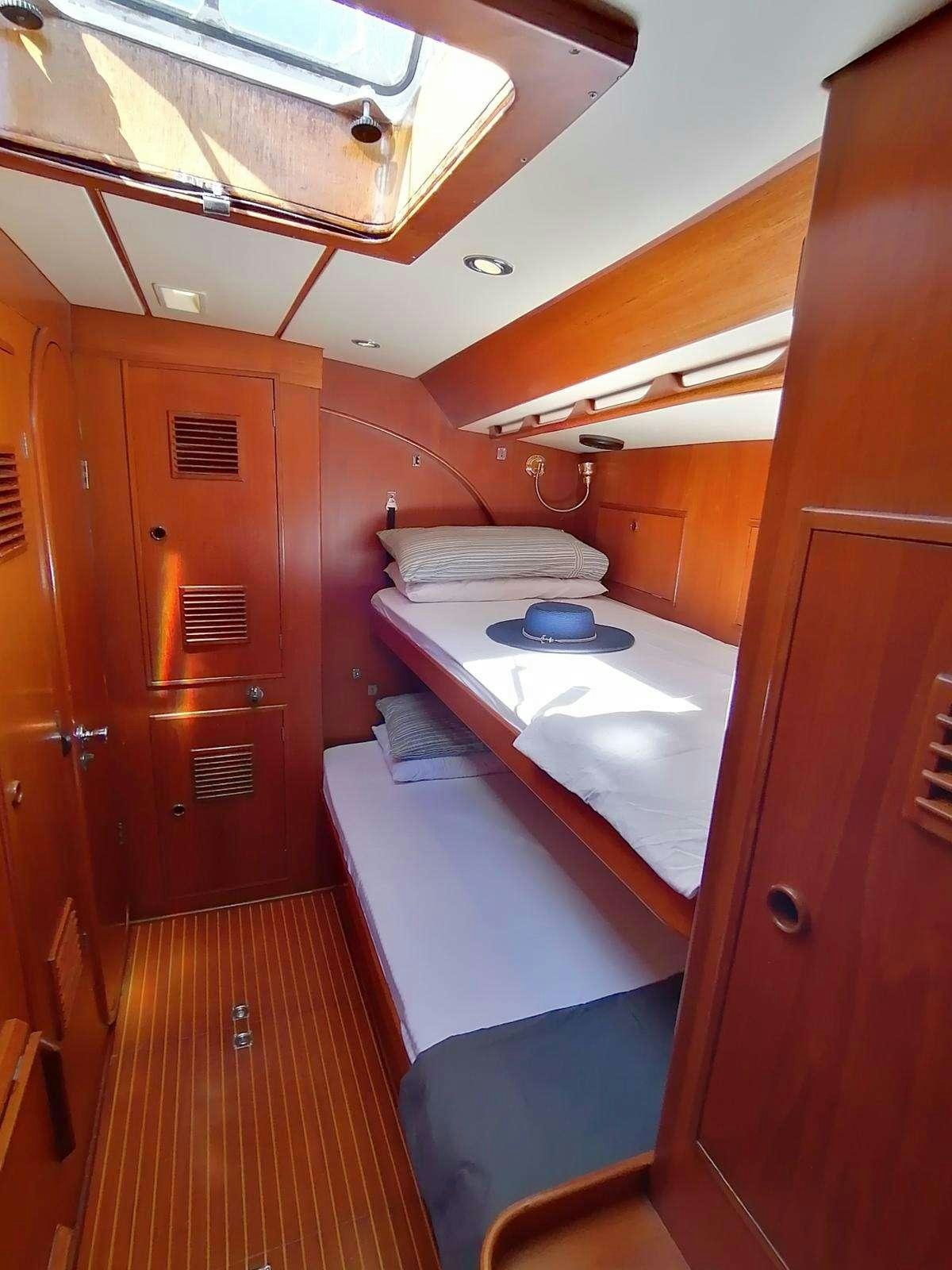 a small bathroom with a bunk bed aboard AURORA Yacht for Charter