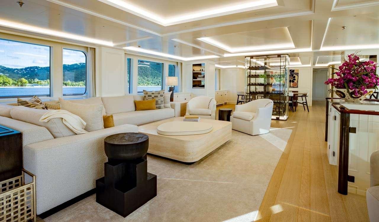 a large living room with a large window aboard BROADWATER Yacht for Charter