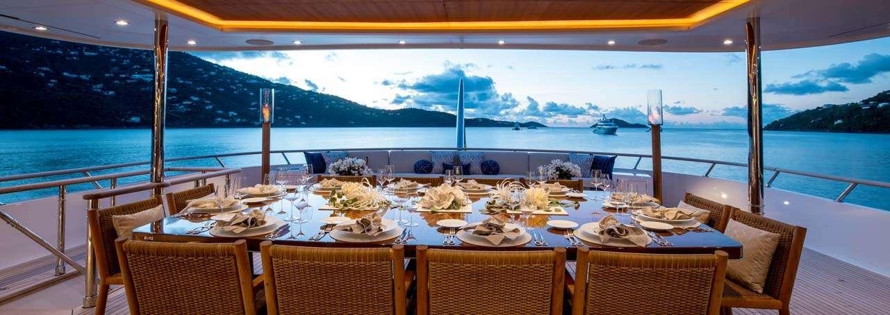 a table set for a dinner aboard BROADWATER Yacht for Charter