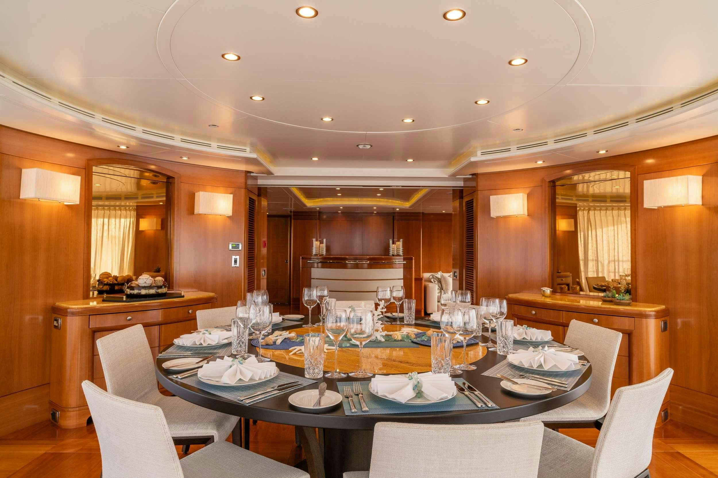 a large dining room with a large table and chairs aboard ALEGRIA Yacht for Charter