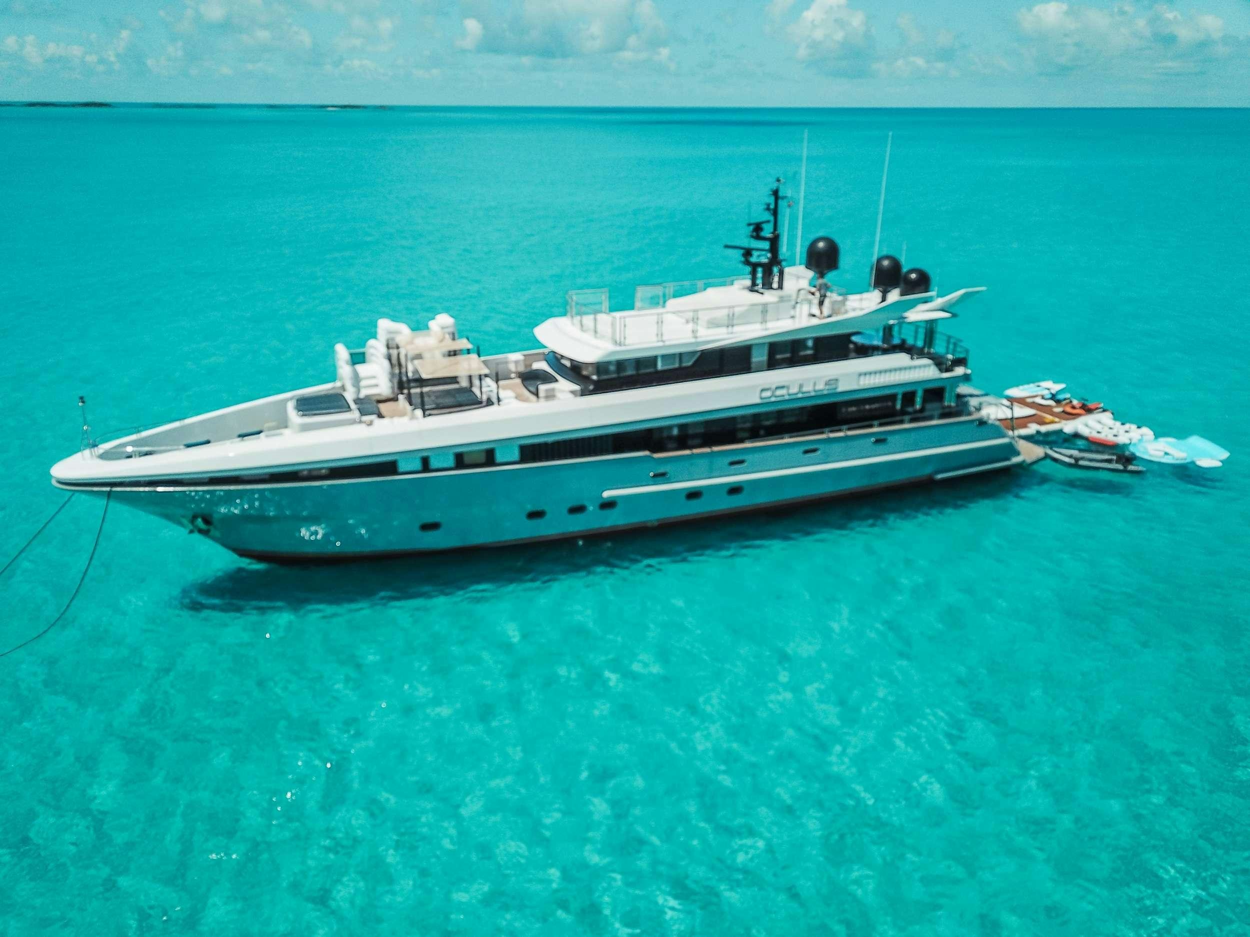 a large white boat in the ocean aboard OCULUS Yacht for Charter