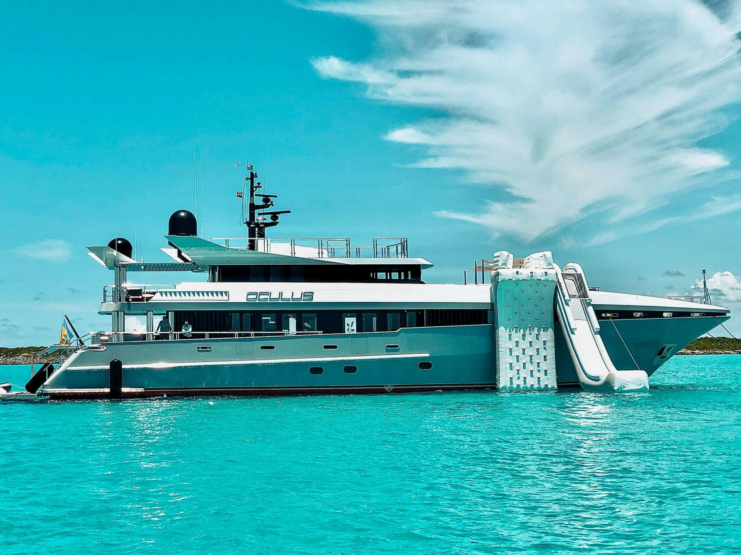 a large ship in the water aboard OCULUS Yacht for Charter