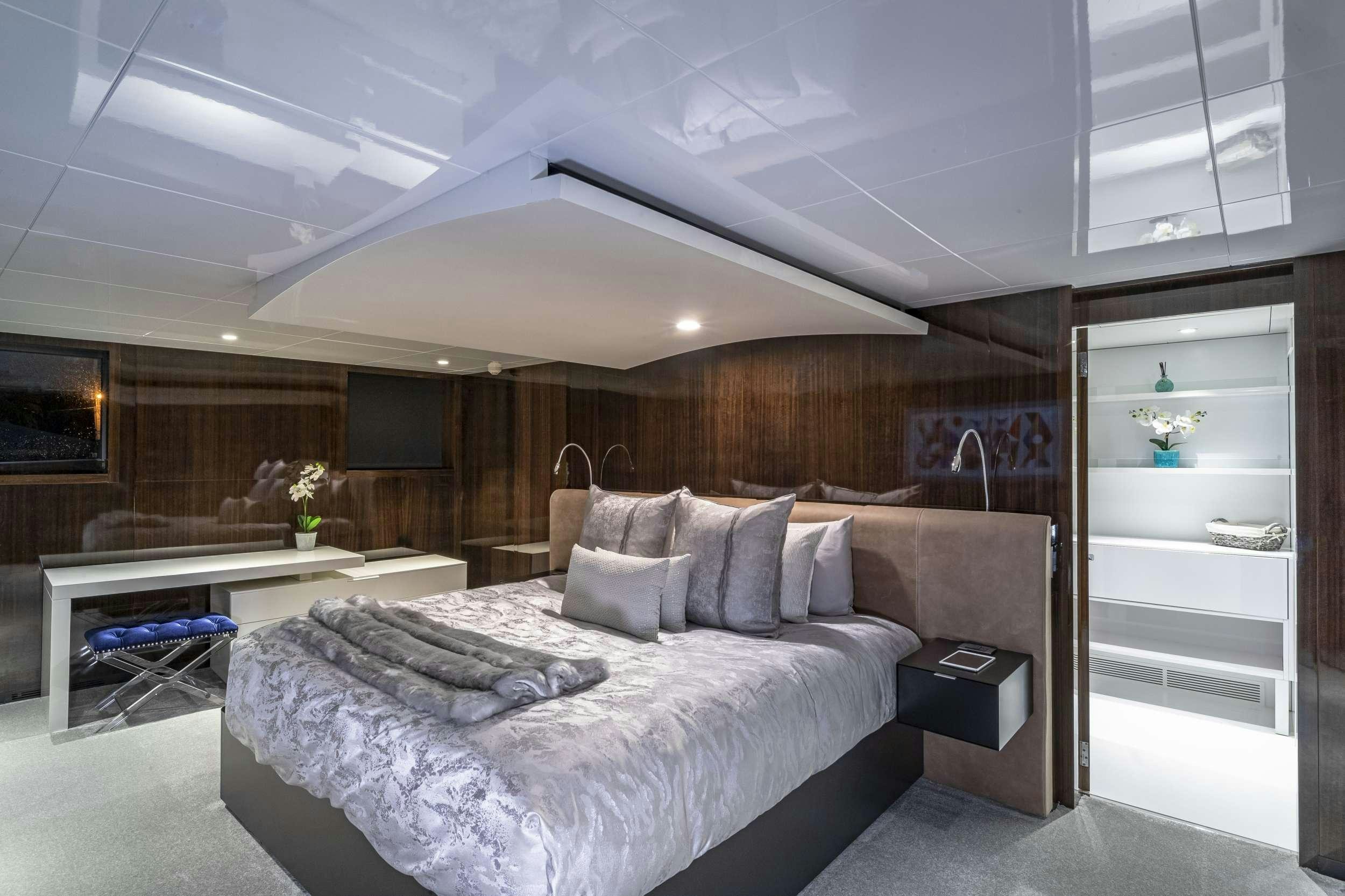 a bed in a room aboard OCULUS Yacht for Charter