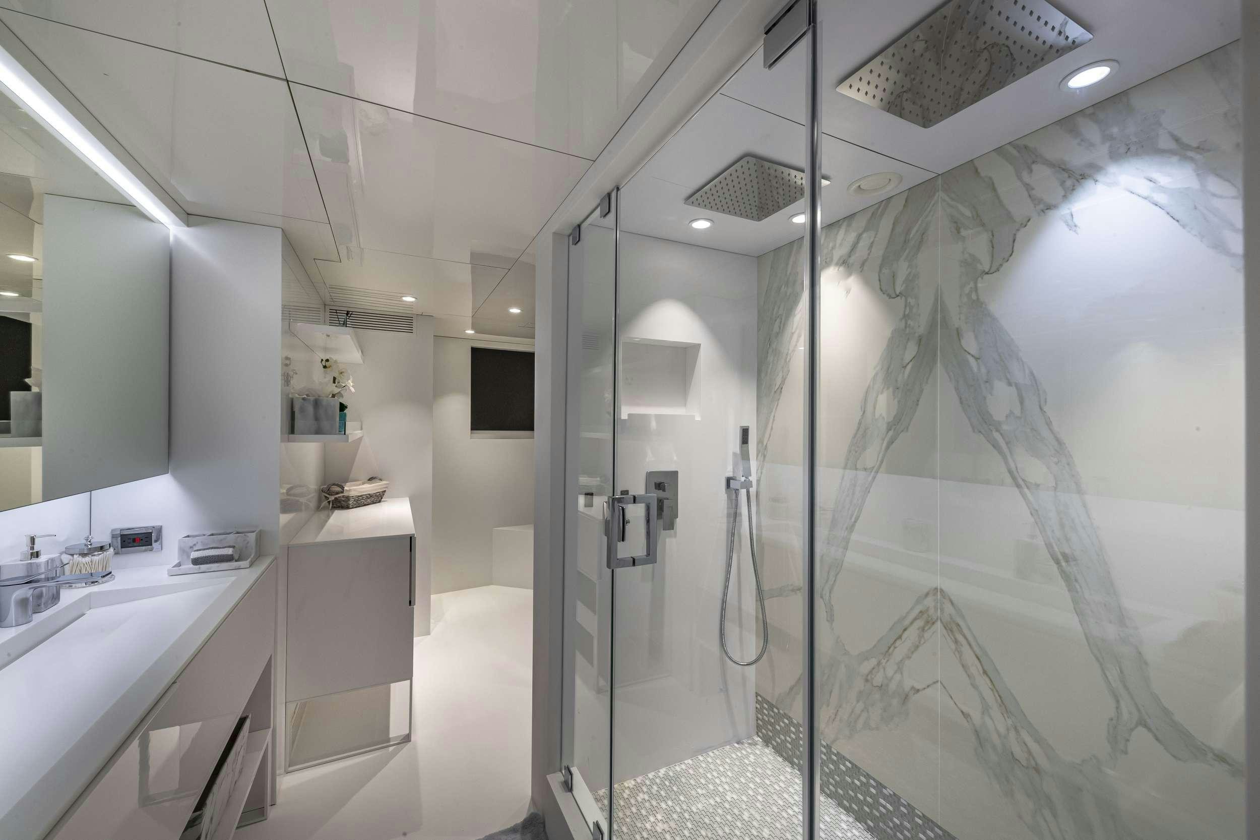 a shower unit in a bathroom aboard OCULUS Yacht for Charter