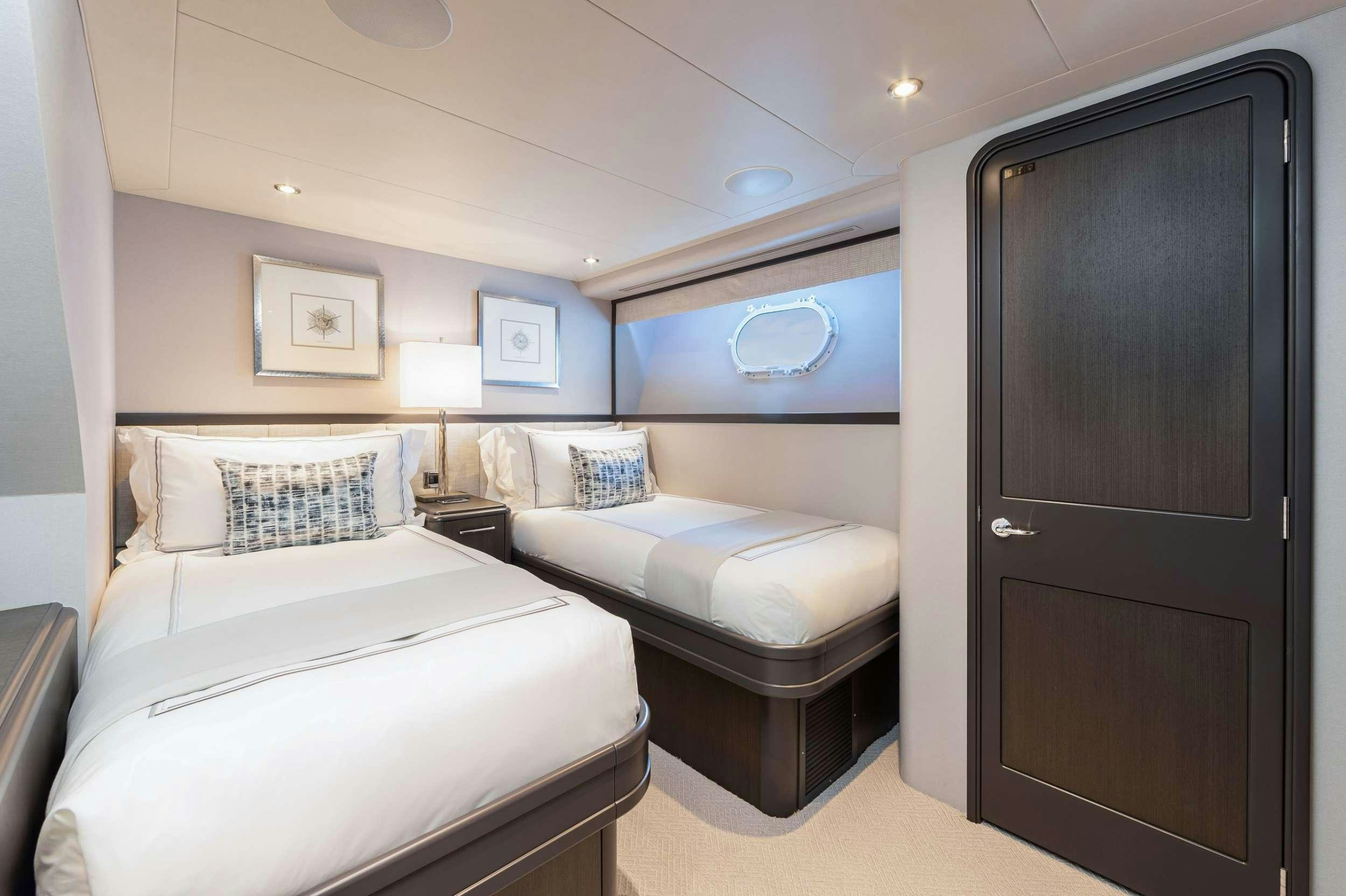 a room with two beds aboard NO BAD IDEAS Yacht for Charter