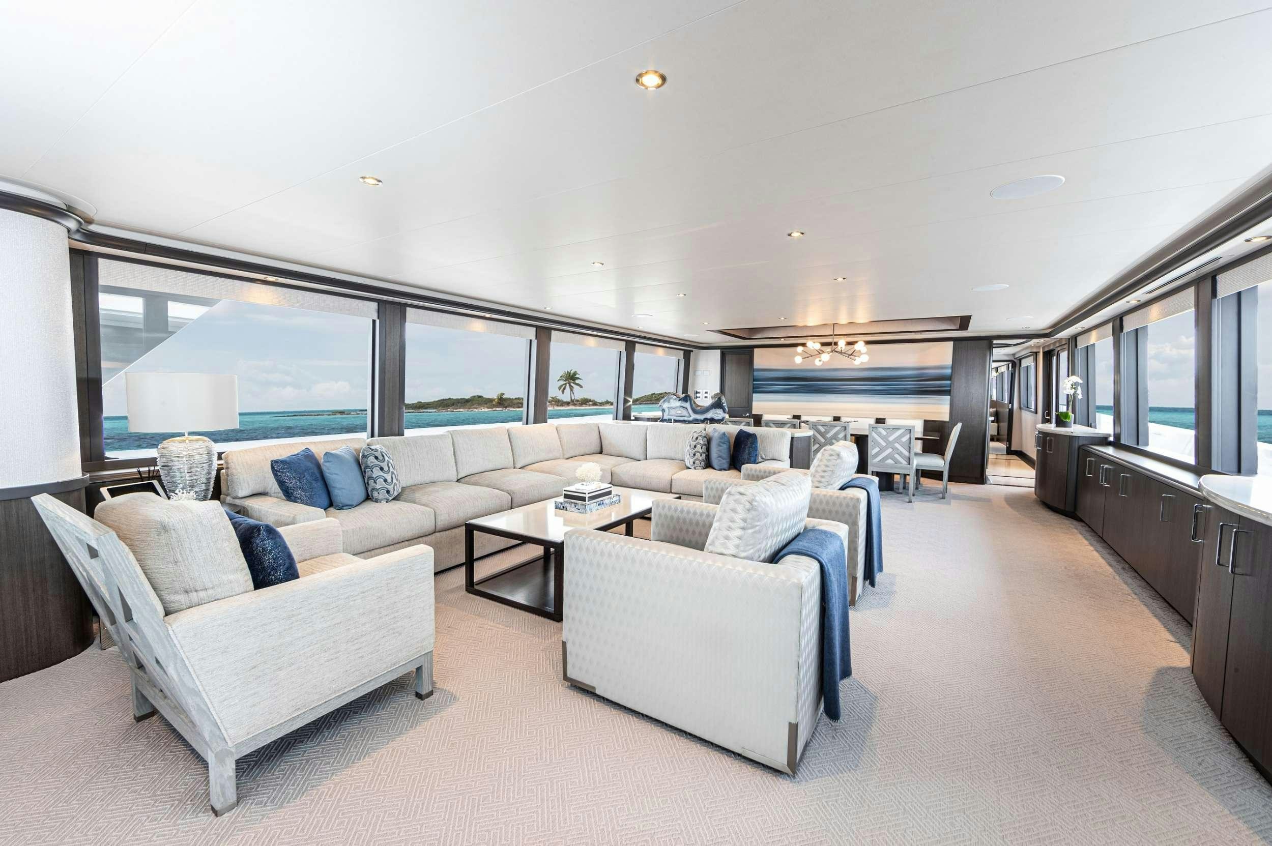 a living room with a large window aboard NO BAD IDEAS Yacht for Charter