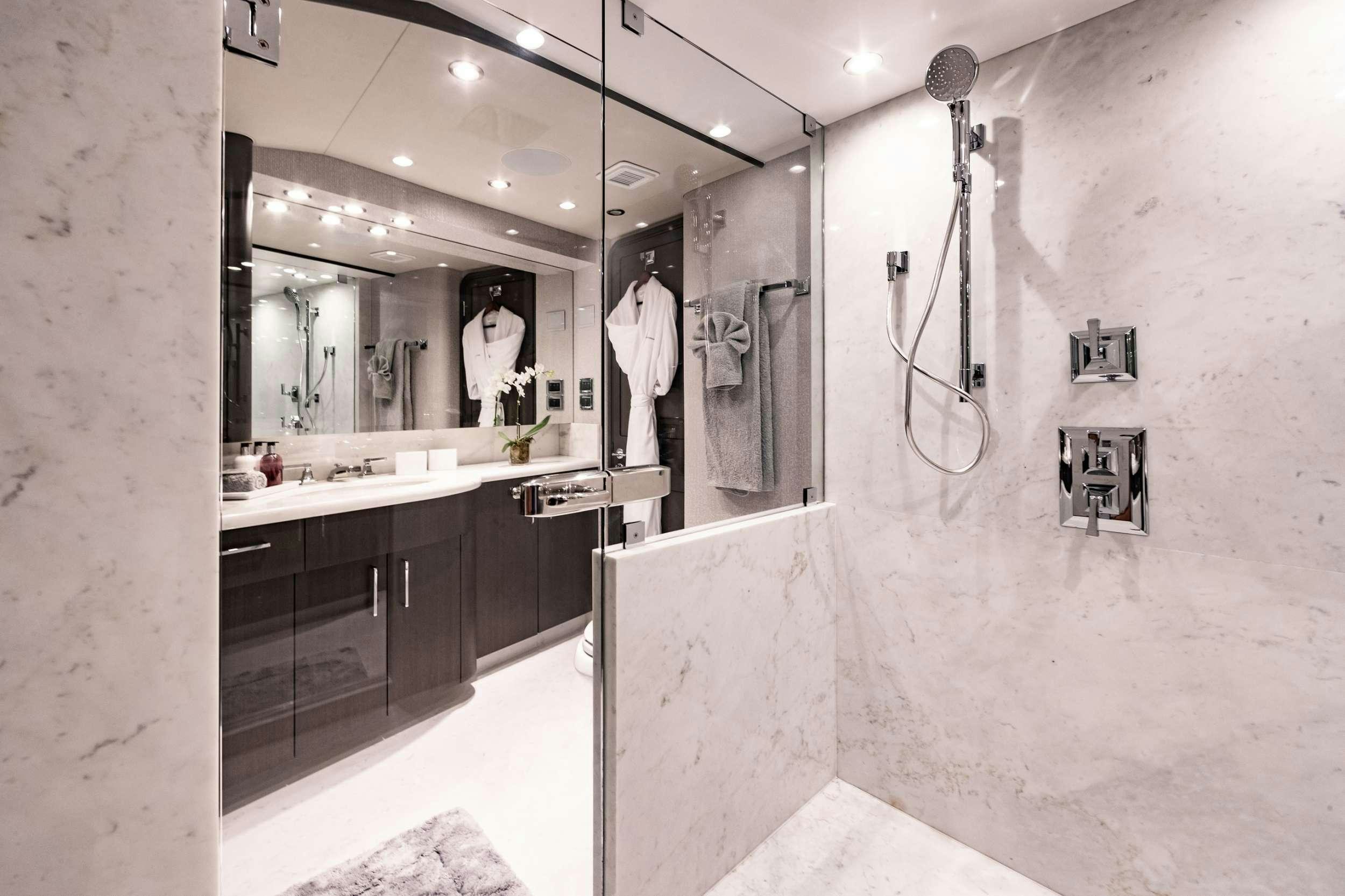 a bathroom with a large mirror aboard NO BAD IDEAS Yacht for Charter