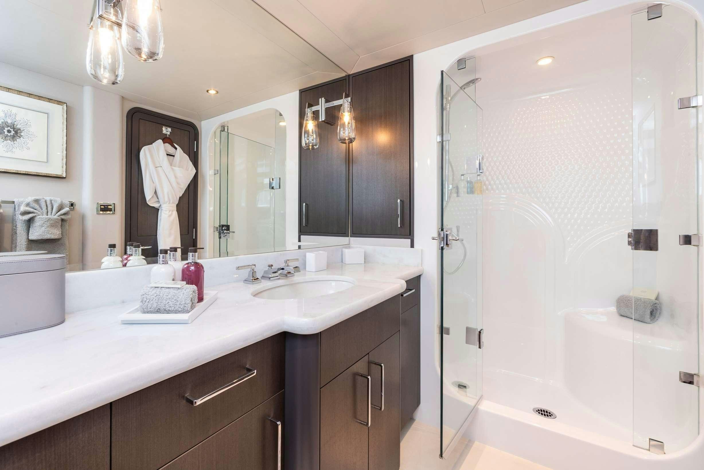 a bathroom with a large mirror aboard NO BAD IDEAS Yacht for Charter