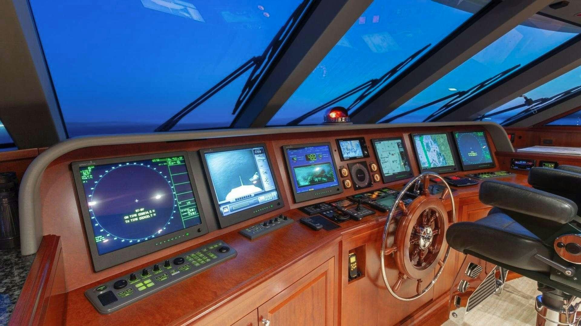 a control panel with many monitors aboard IMPETUOUS Yacht for Charter