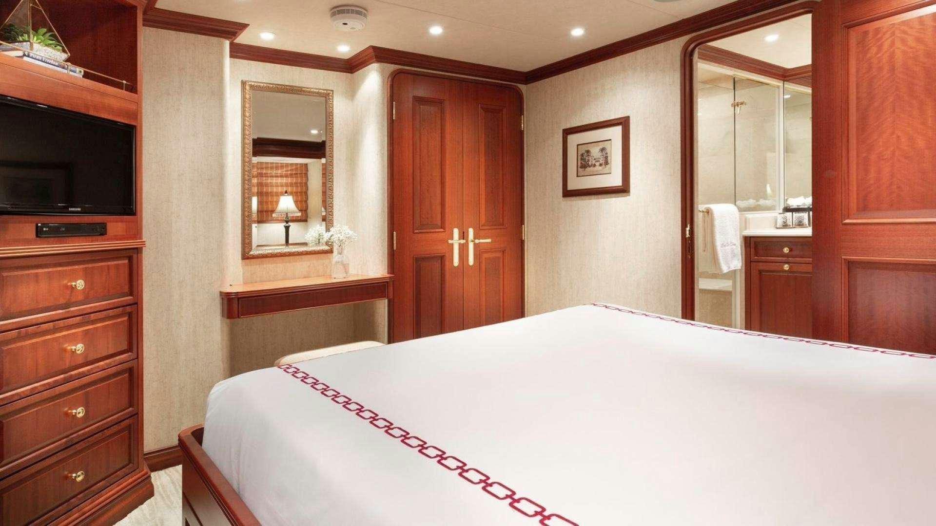 a large bedroom with a large bed aboard IMPETUOUS Yacht for Charter