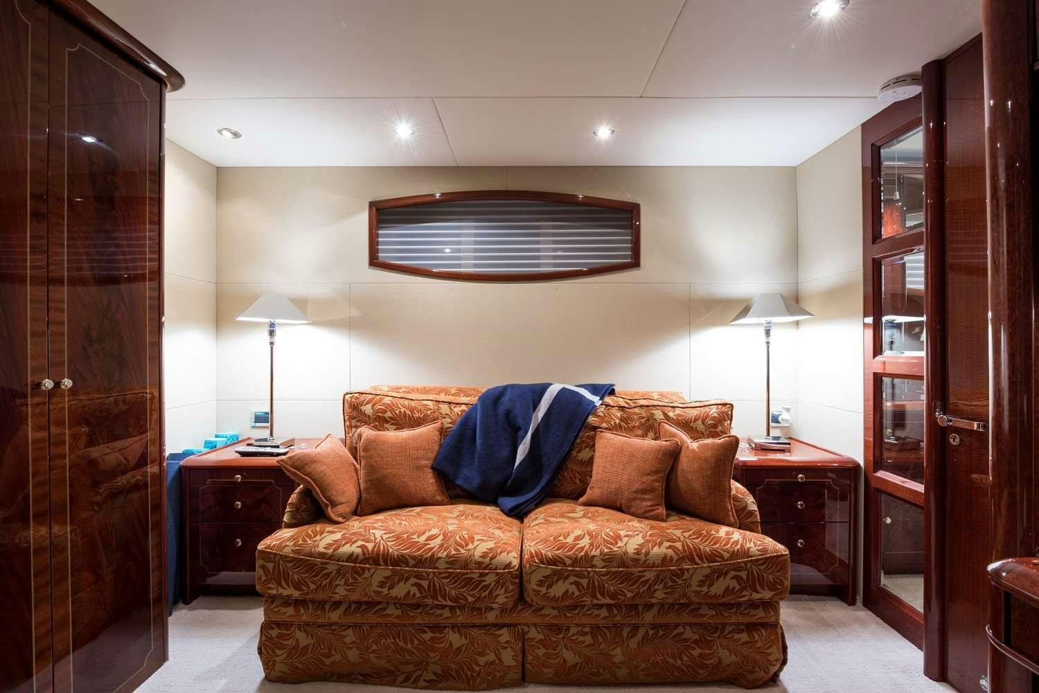 a living room with a couch aboard QTR Yacht for Charter
