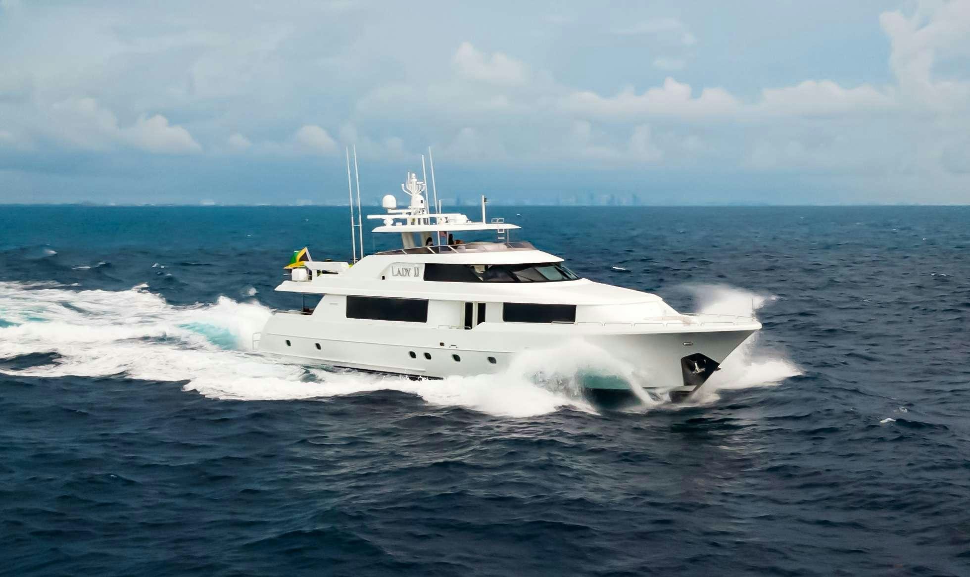 a white yacht on the water aboard JEANNIETINI Yacht for Charter