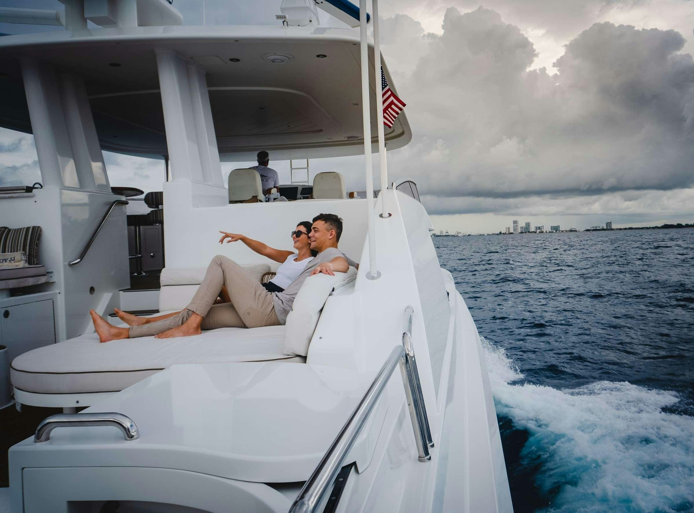 a couple of people on a boat aboard JEANNIETINI Yacht for Charter