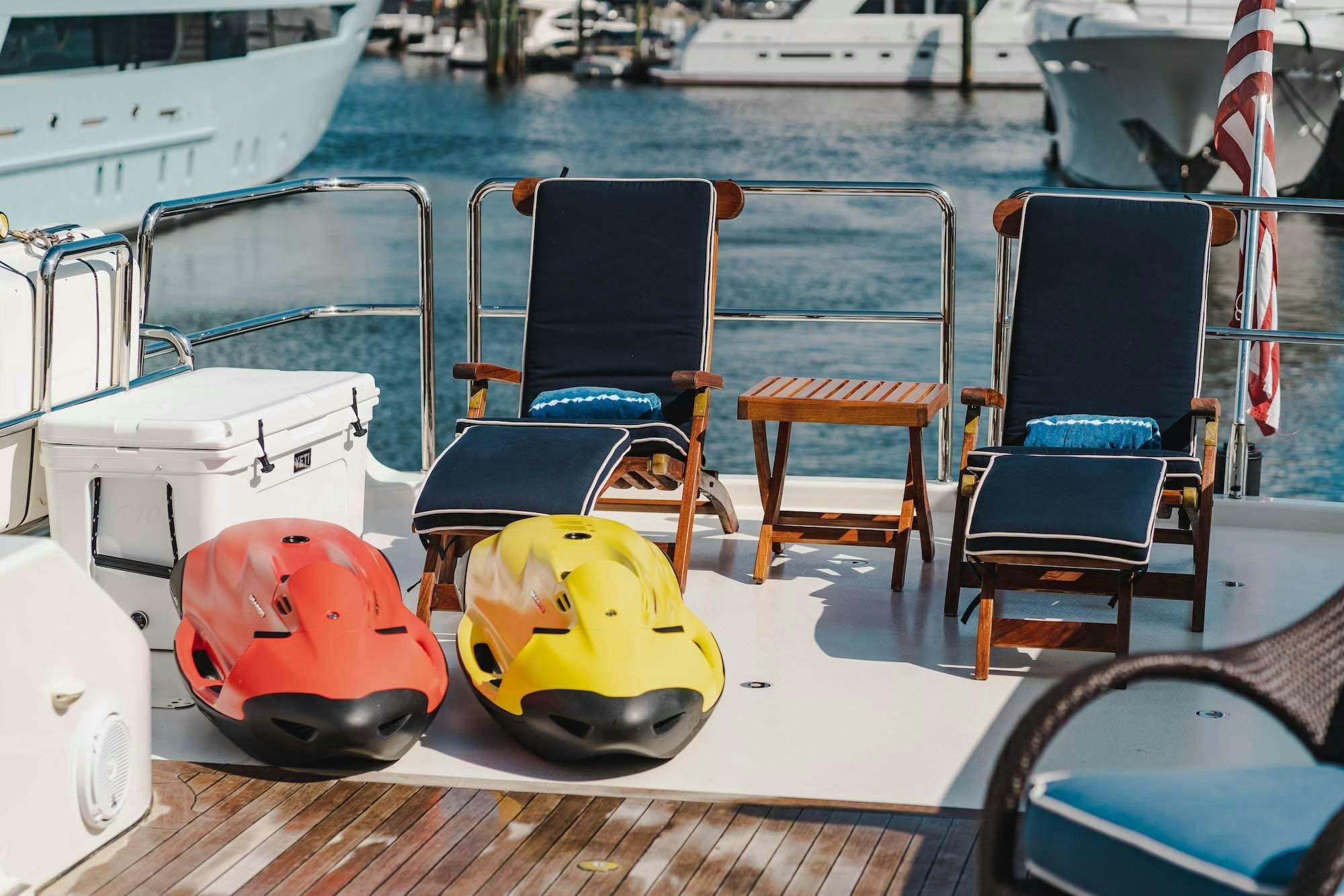 a couple of chairs on a boat aboard NOW OR NEVER Yacht for Charter