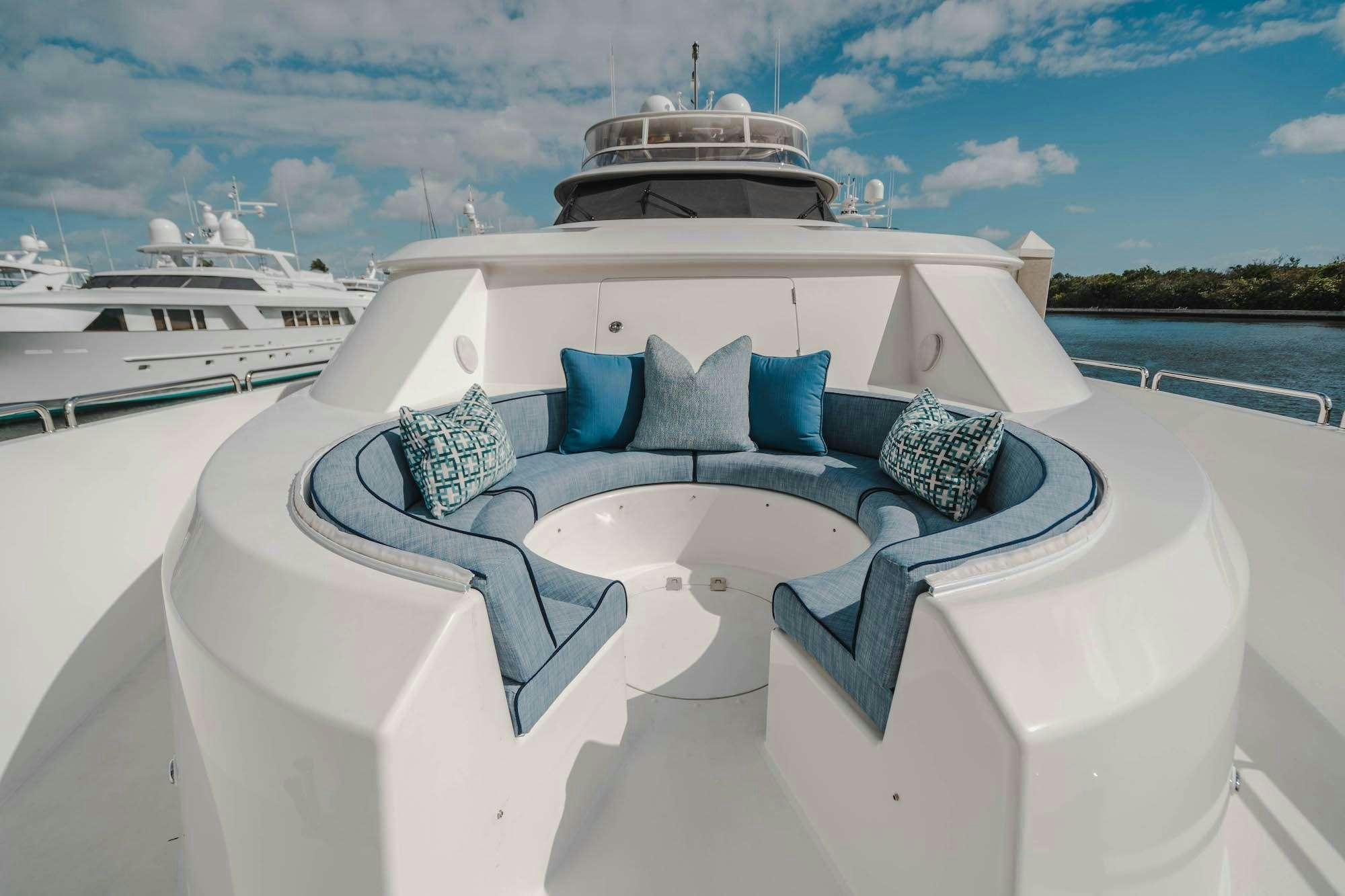 a white boat with pillows on it aboard NOW OR NEVER Yacht for Charter