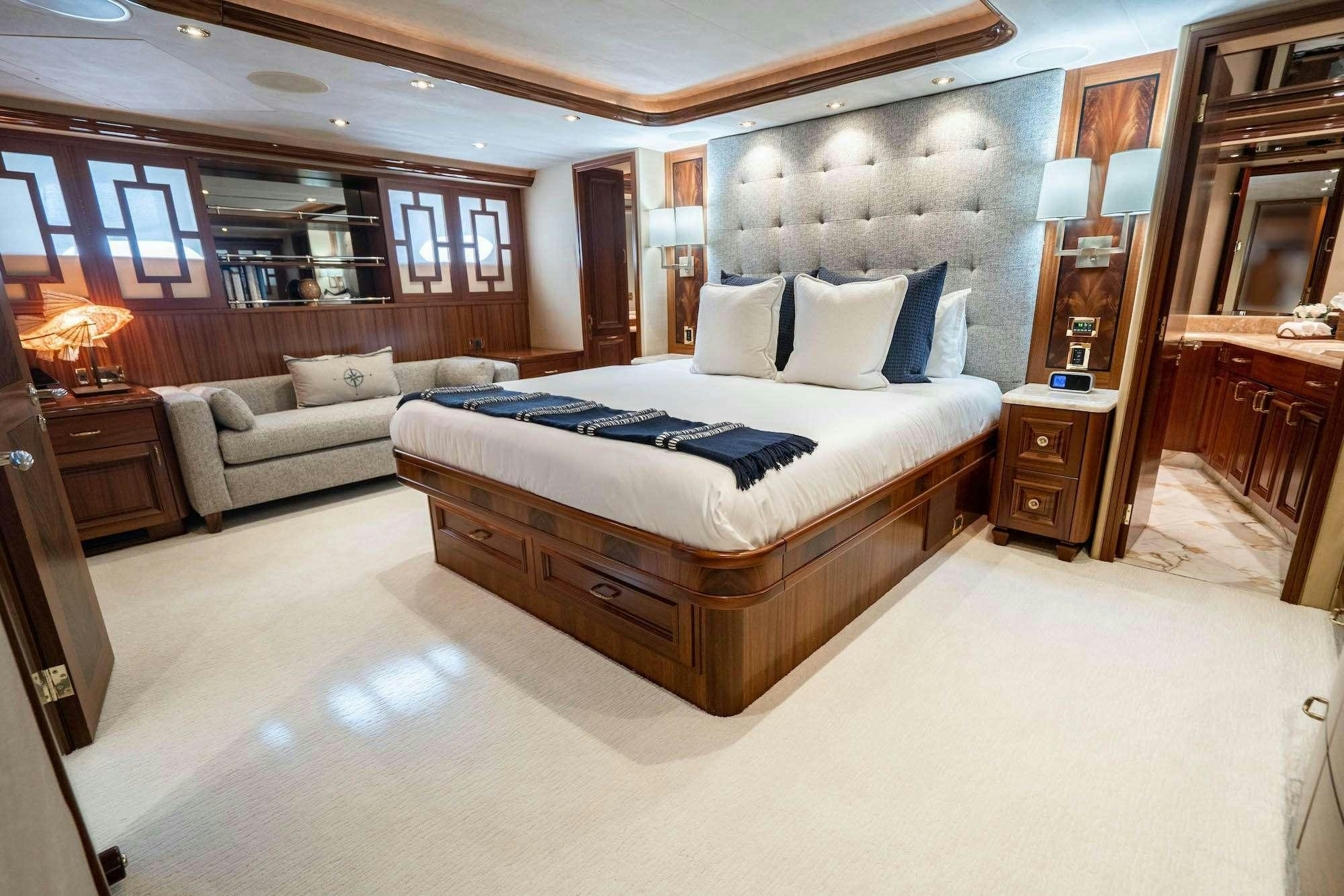 a large bedroom with a bed aboard NOW OR NEVER Yacht for Charter