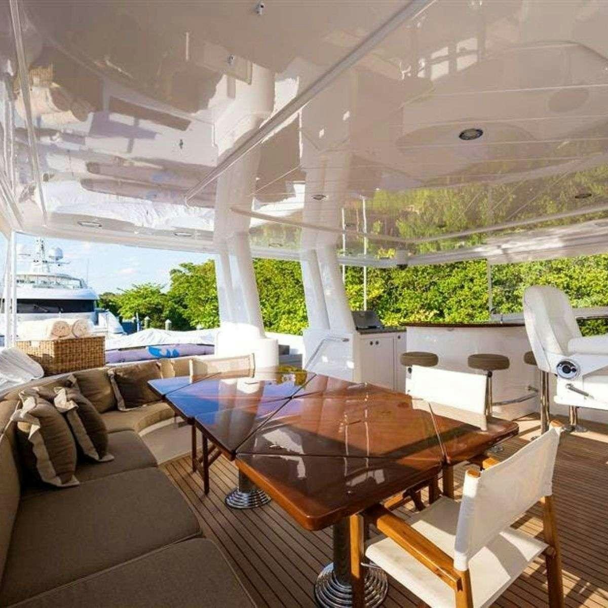 a room with a table and chairs aboard NATURAL 9 Yacht for Charter