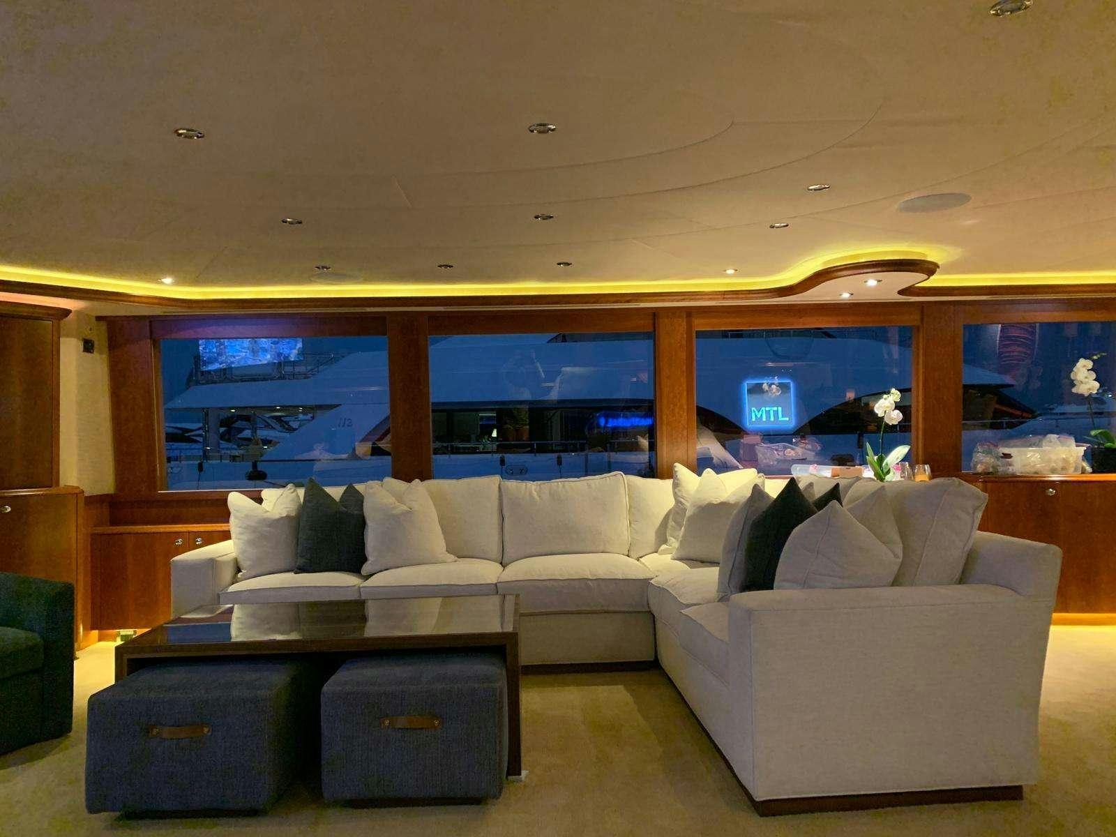 a living room with a couch aboard NATURAL 9 Yacht for Charter