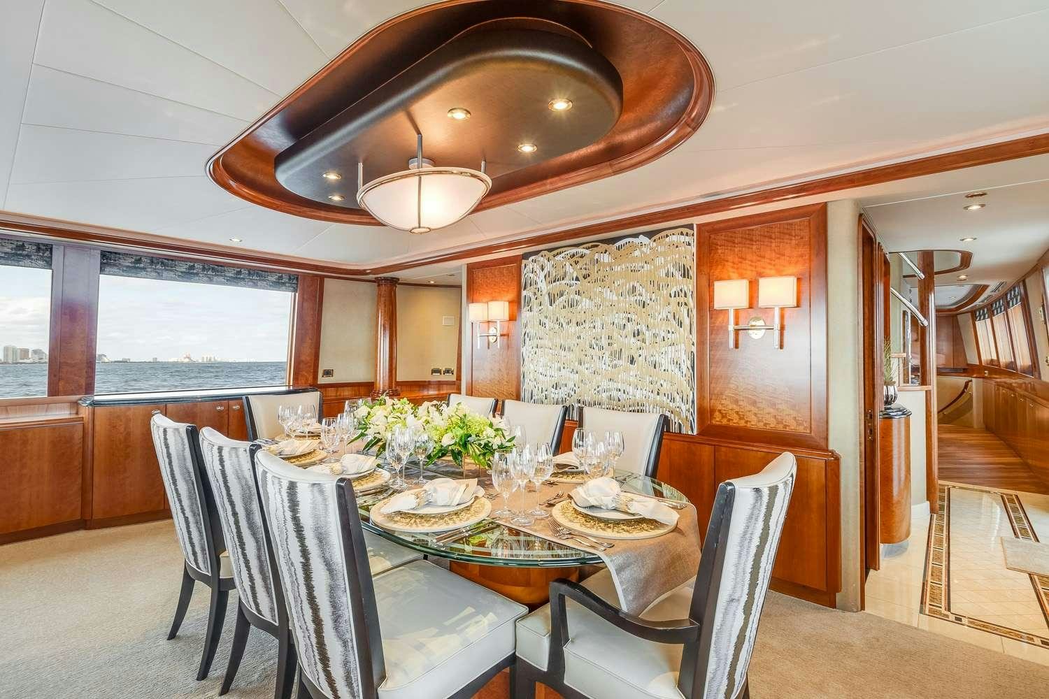 a dining room with a table and chairs aboard MY WAY Yacht for Charter